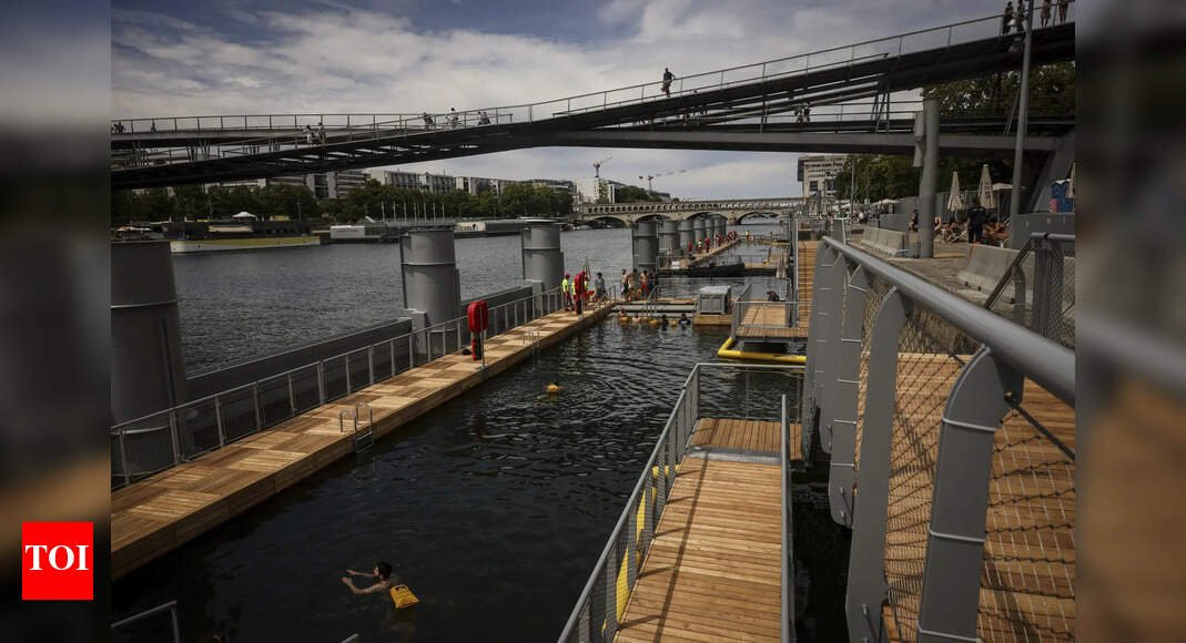 ‘feel-like-a-mermaid’:-river-seine-reopens-after-century-long-ban;-parisians-rejoice-‘childhood-dream’