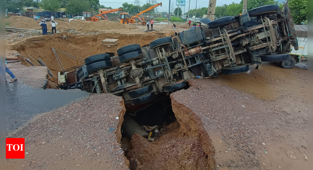 gurgaon’s-monsoon-meltdown:-massive-road-cave-in-in-city;-pit-swallows-14-tyre-truck