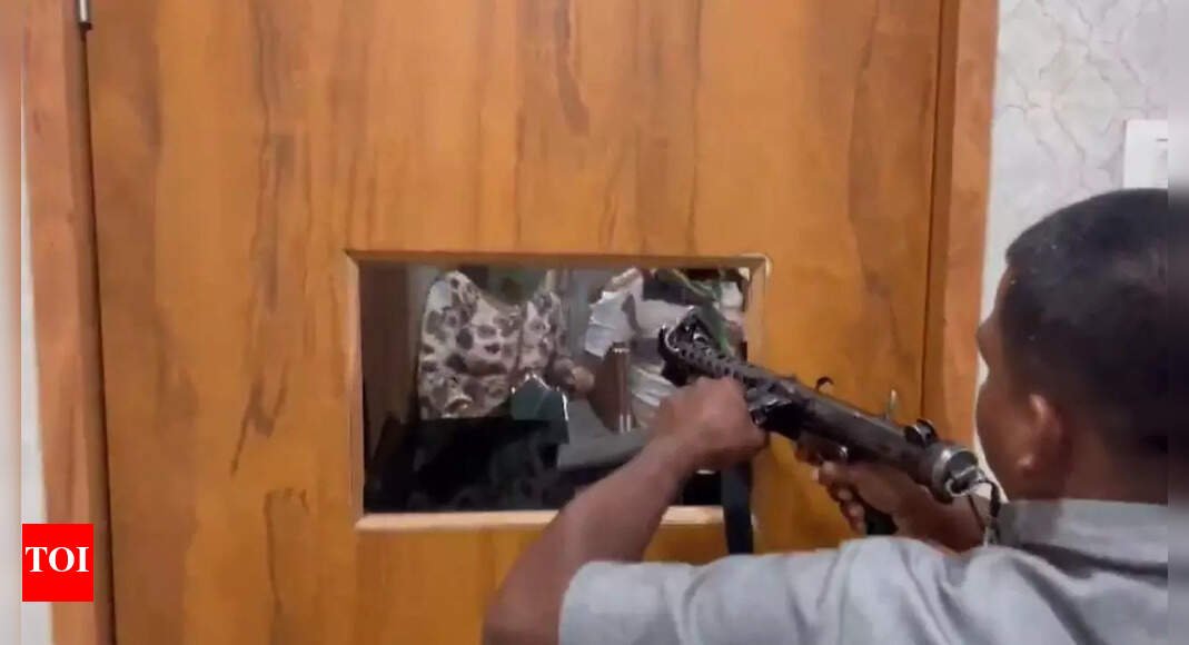 watch:-telangana-cong-mlc’s-office-attacked-by-mob;-bodyguard-fires-in-air