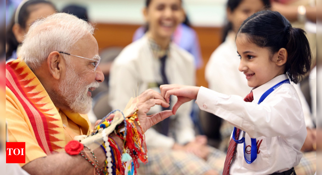 raksha-bandhan-with-the-pm:-modi-shares-cute-moment-with-children-–-pics