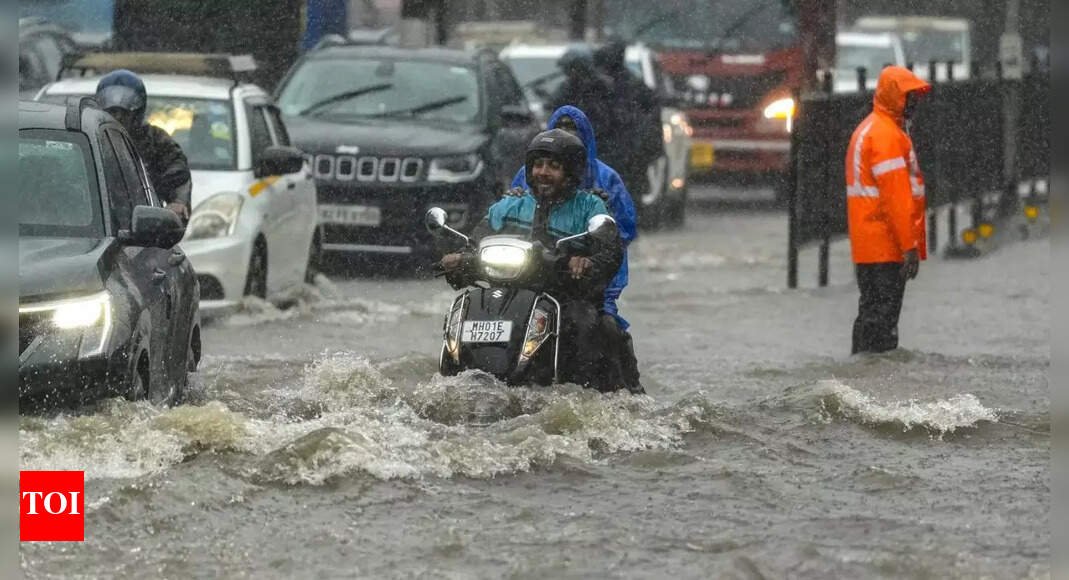 mumbai-rains:-heavy-showers-flood-roads-tracks,-bring-city-to-standstill-–-video