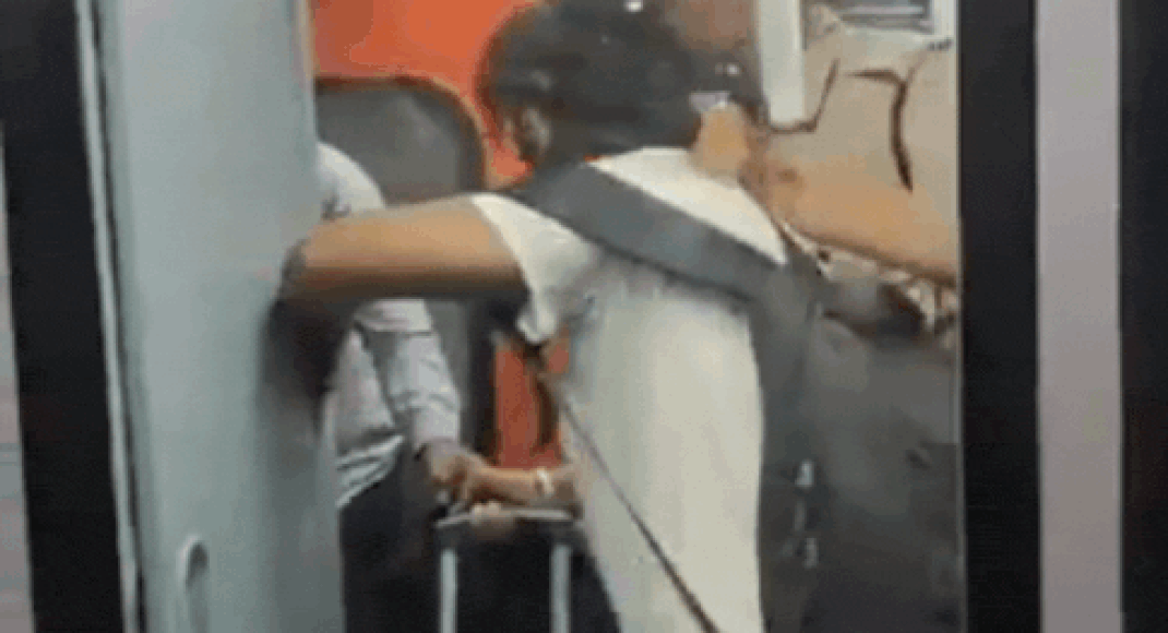 watch:-constable-caught-trying-to-push-passenger-out-of-train