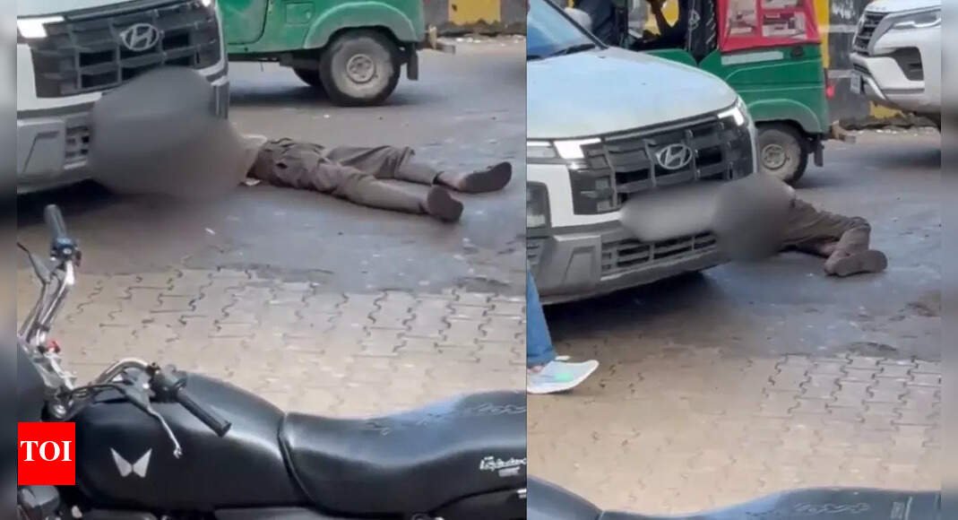 watch:-drunk-man-lying-on-road-run-over-by-suv-in-gurgaon,-survives