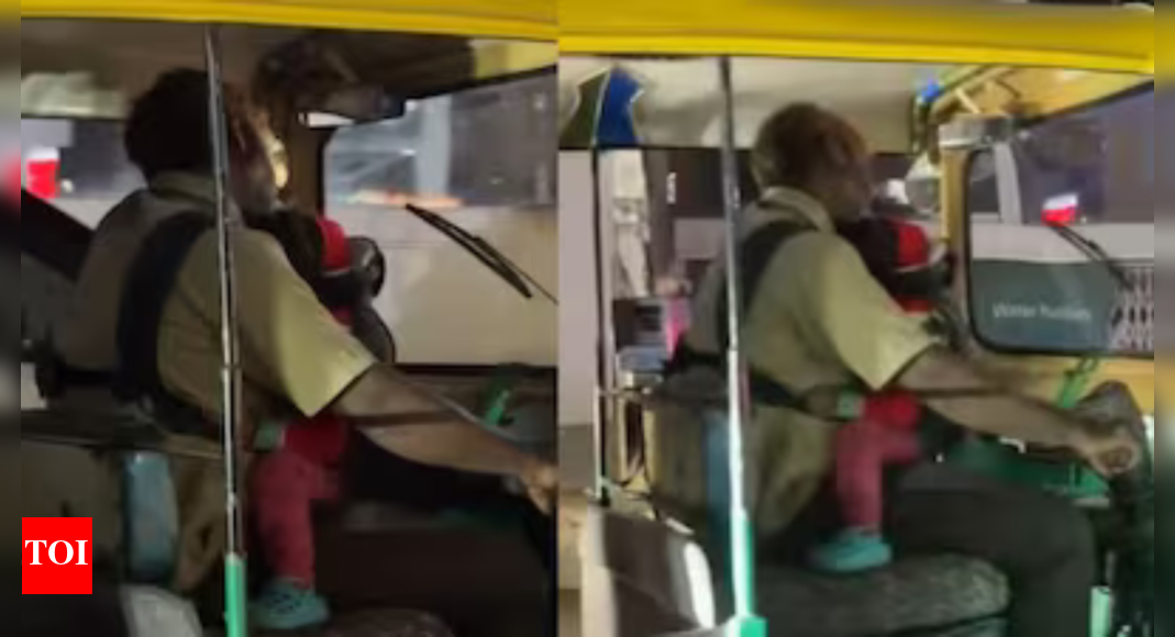 baby-in-one-arm,-wheel-in-the-other:-auto-driver-cradles-infant-while-driving;-video-goes-viral