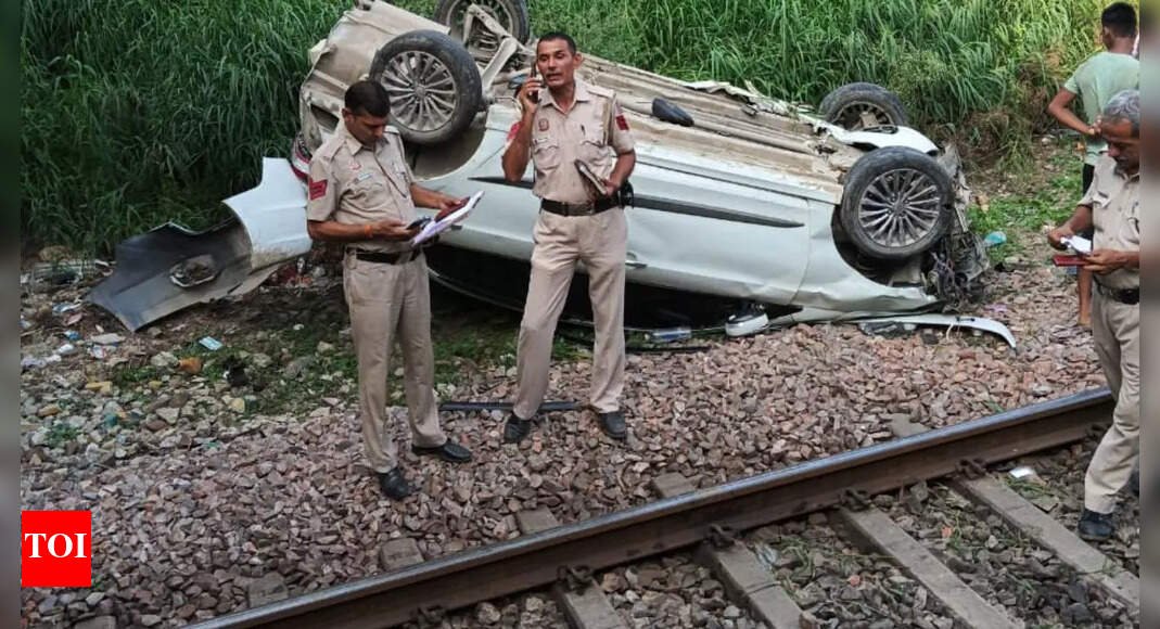 car-plunges-from-flyover-onto-railway-tracks-in-delhi;-train-services-halted