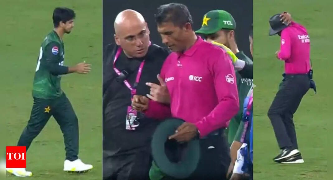 chaos!-umpire-hit-on-ear-by-pakistan-fielder’s-throw,-play-halted-in-dubai