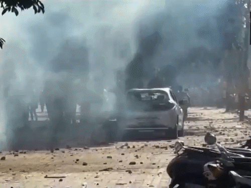 factory-protest-turns-violent-in-noida:10-vehicles-torched,-police-car-overturned;-tear-gas-used-to-disperse-rampaging-mob