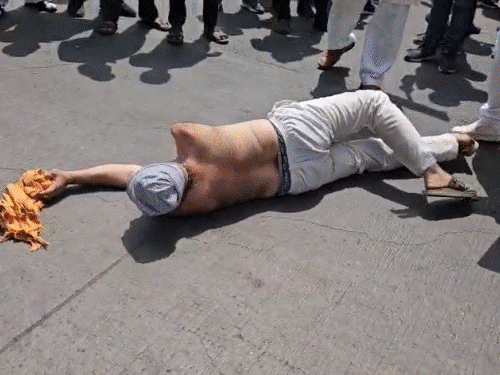 farmers-stage-protest-with-food-supplies-against-land-acquisition:specially-abled-protestors-rolls-on-scorching-road-outside-collectorate