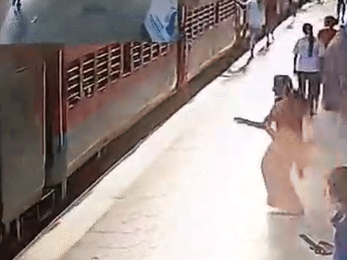 woman-loses-both-legs-boarding-moving-train:three-year-old-son-also-falls,-cctv-footage-captures-accident-at-itarsi-station