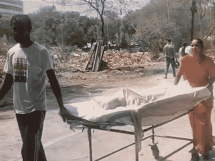 parents-forced-to-push-child-on-stretcher-for-1-km:mother-shields-son-with-wet-cloth;-lack-of-help-sparks-outrage
