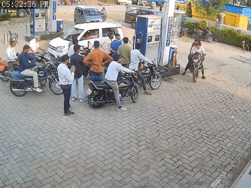 watch-|-father-son-duo-outsmarts-haryana-police-custody:cctv-shows-accused-fleeing-with-police-vehicle-moments-after-refuelling
