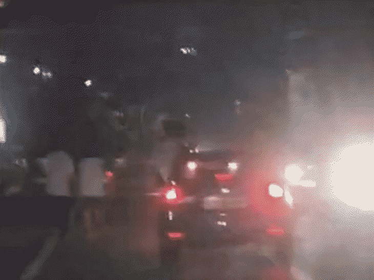 video|-reels-over-rules?:youths-hang-from-moving-car-in-ujjain;-police-seize-vehicle